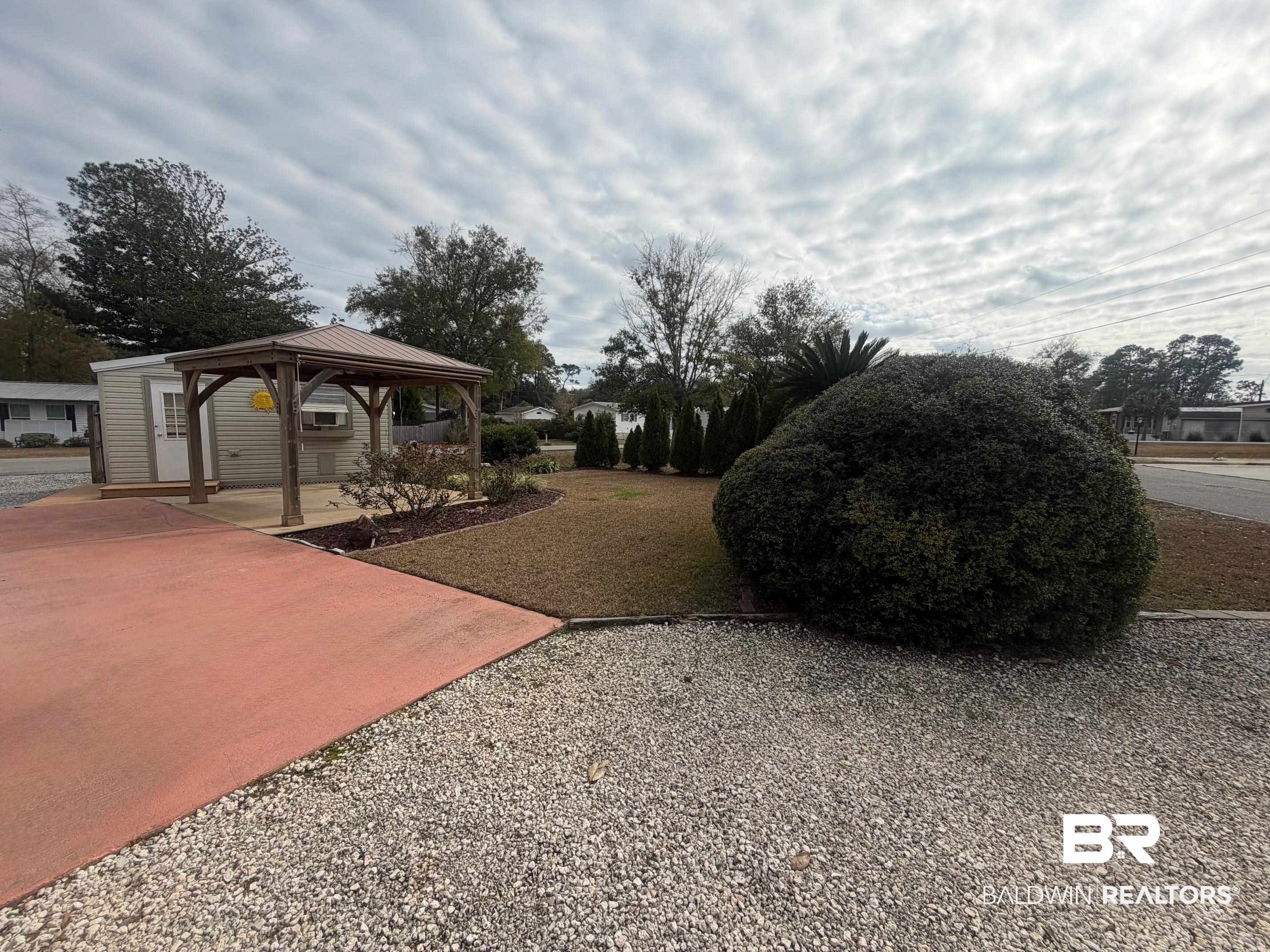 675 Escambia Loop Lillian, AL 36549 - Photo 22 of 44 View of yard with a gazebo and a patio