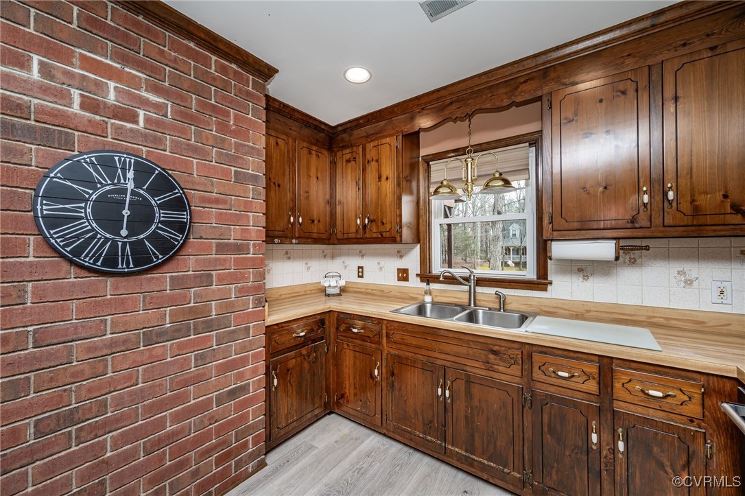 4724 Brookridge Road Chesterfield, VA 23832 - Photo 7 of 23 Kitchen featuring light wood-type flooring, sink,