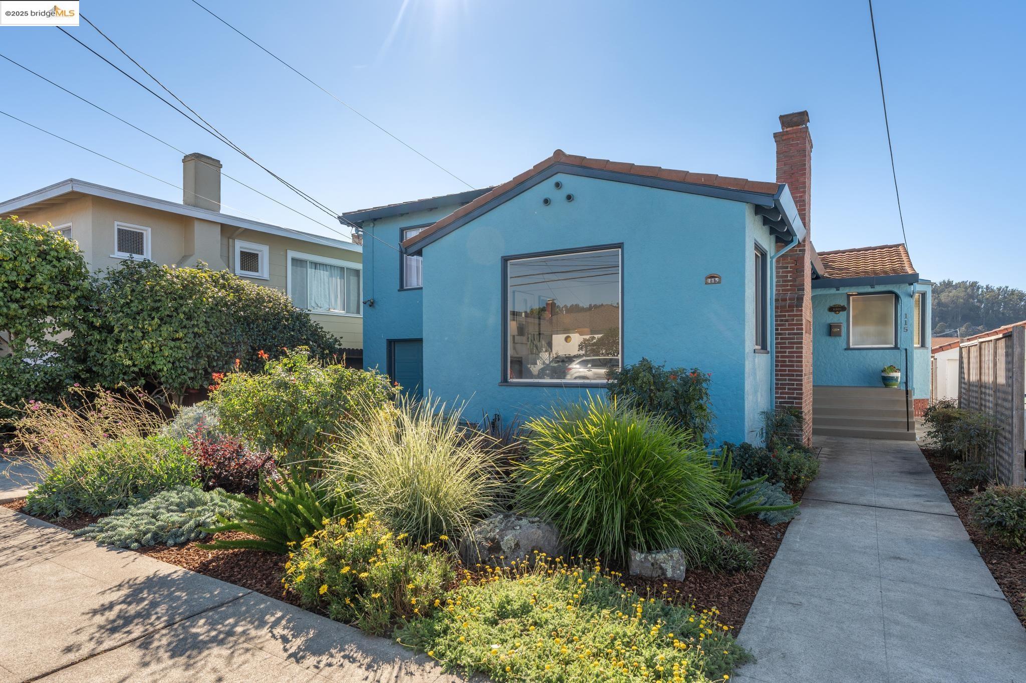a front view of house and yard with green space
