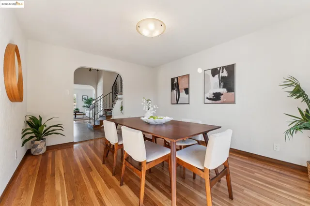 a kitchen with kitchen island granite countertop a stove a sink and a refrigerator with wooden cabinets