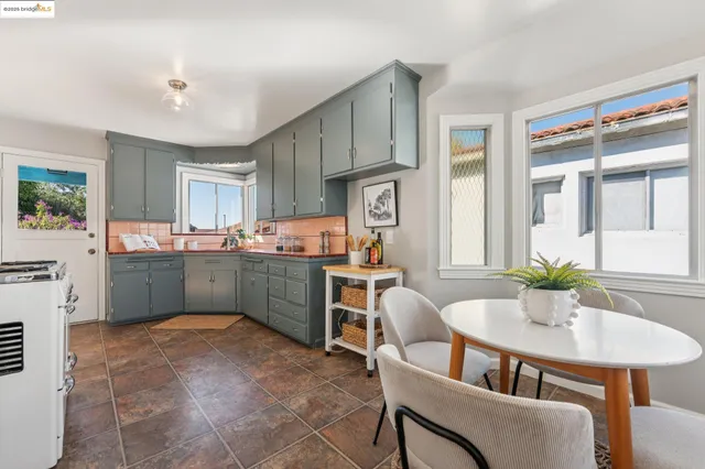 a view of a hallway with wooden floor and stairs