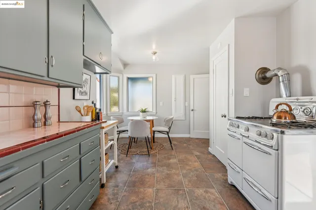 a bed room with a bed and a chair