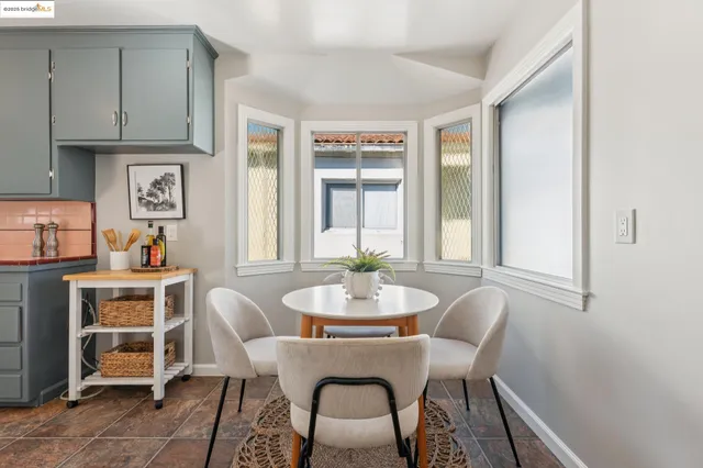 a bedroom with a bed a table and chair