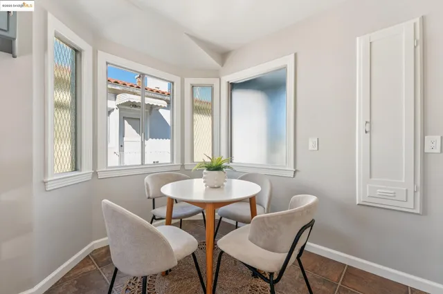 a bedroom with a bed and a table