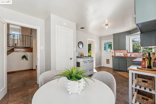 a view of a hallway with wooden floor and stairs