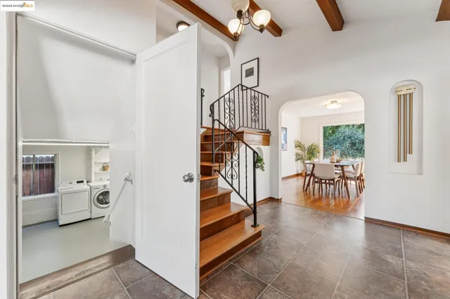 a view of a room with wooden floor and white walls