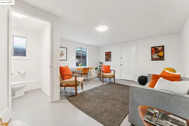 a view of a livingroom with furniture and cabinet