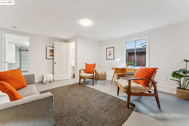 a view of a patio with table and chairs and potted plants
