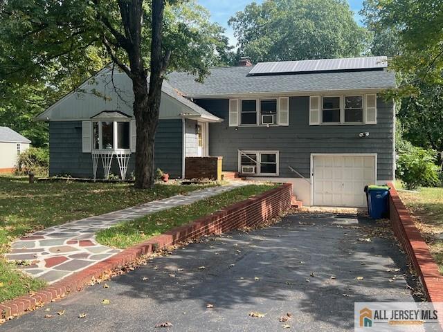 52 Emerson Road Somerset, NJ 08873 - Photo 1 of 1 a front view of a house with a yard and garage