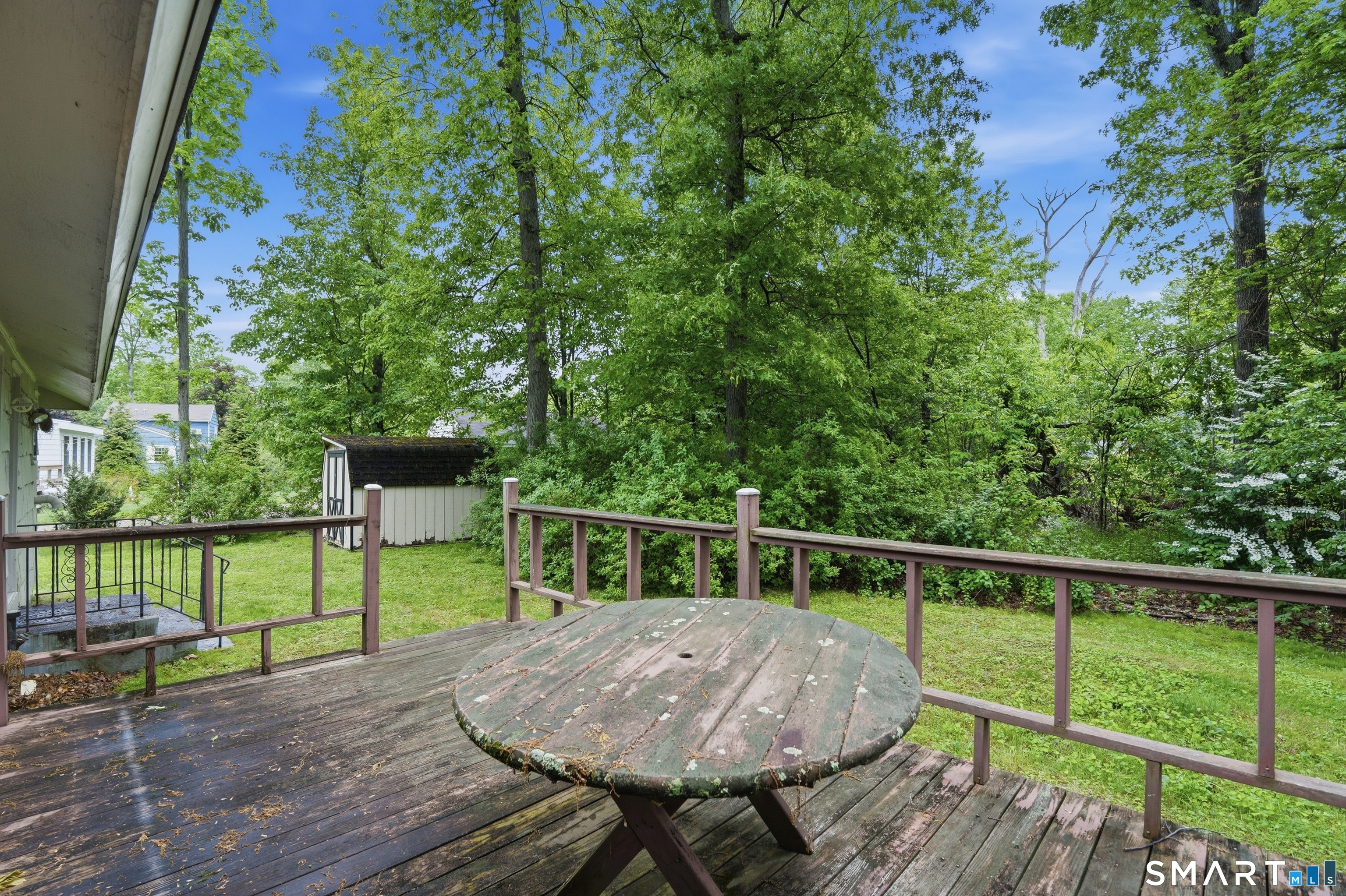 731 Still Hill Road Hamden, CT 06518 - Photo 34 of 40 a view of house with deck and outdoor seating