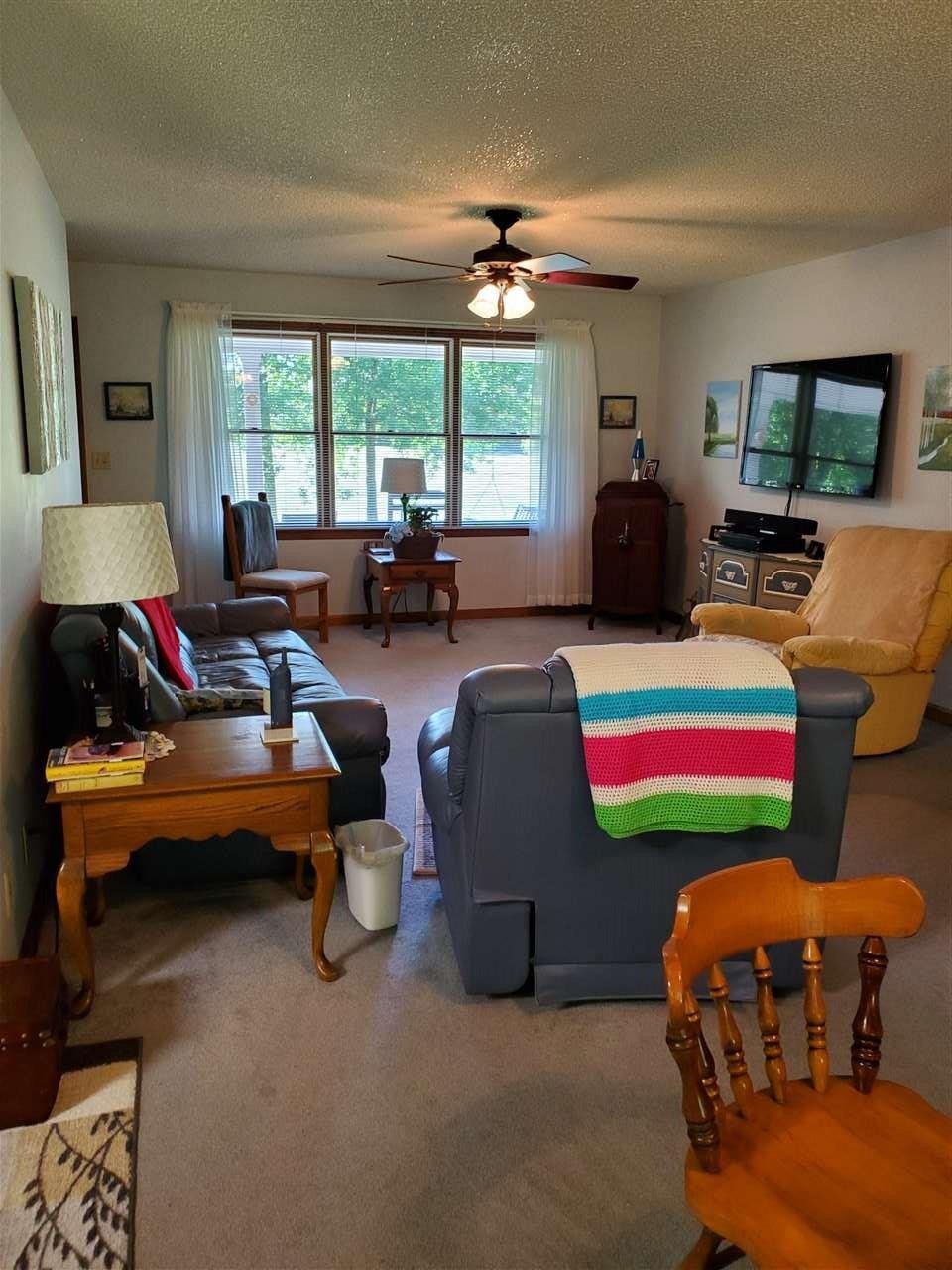 1627 Strawhill Road Southeast Cleveland, TN 37323 - Photo 11 of 48 a living room filled with furniture and a chandelier