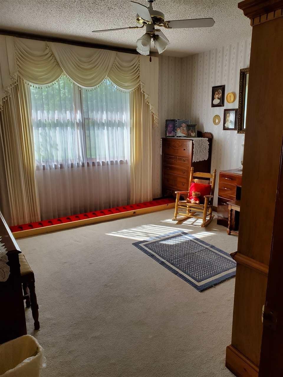 1627 Strawhill Road Southeast Cleveland, TN 37323 - Photo 12 of 48 a room with furniture and a window