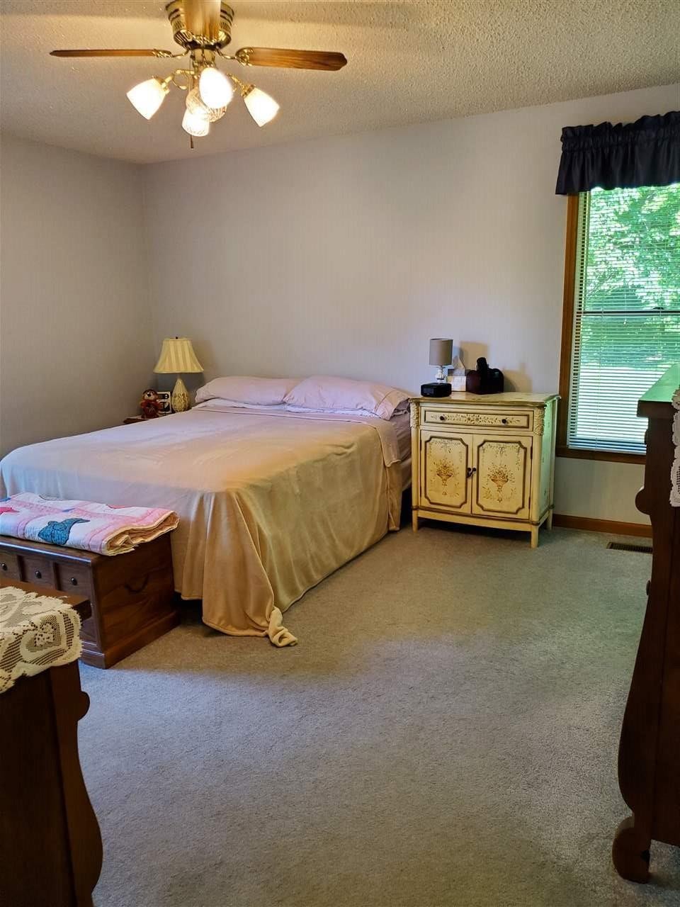 1627 Strawhill Road Southeast Cleveland, TN 37323 - Photo 20 of 48 a spacious bedroom with a bed and a chandelier