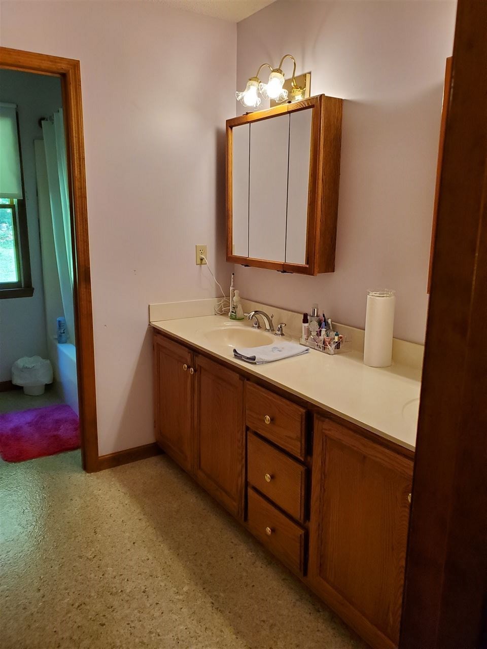 1627 Strawhill Road Southeast Cleveland, TN 37323 - Photo 22 of 48 a bathroom with a double vanity sink and a mirror