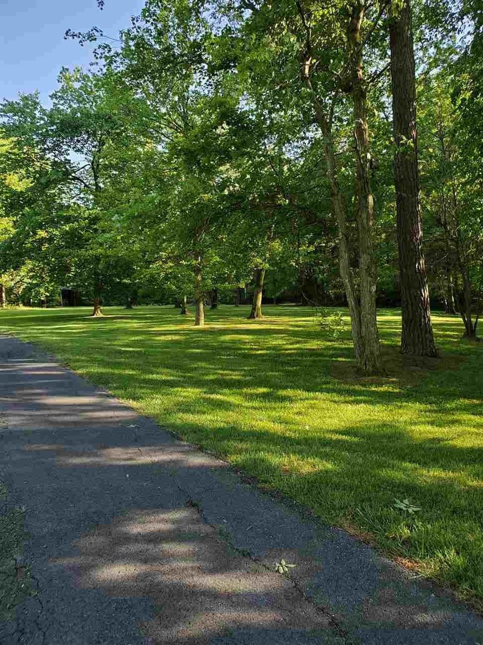 1627 Strawhill Road Southeast Cleveland, TN 37323 - Photo 45 of 48 a grassy field with trees in the background