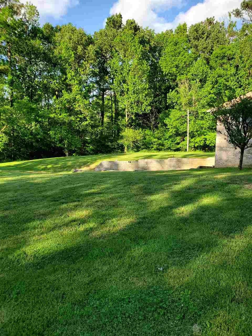 1627 Strawhill Road Southeast Cleveland, TN 37323 - Photo 48 of 48 a view of a grassy field with trees