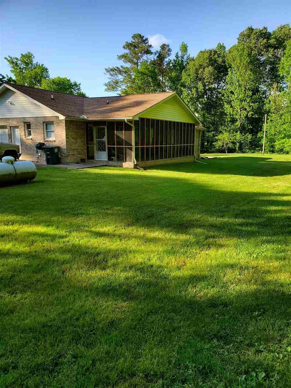 1627 Strawhill Road Southeast Cleveland, TN 37323 - Photo 5 of 48 a front view of a house with a garden