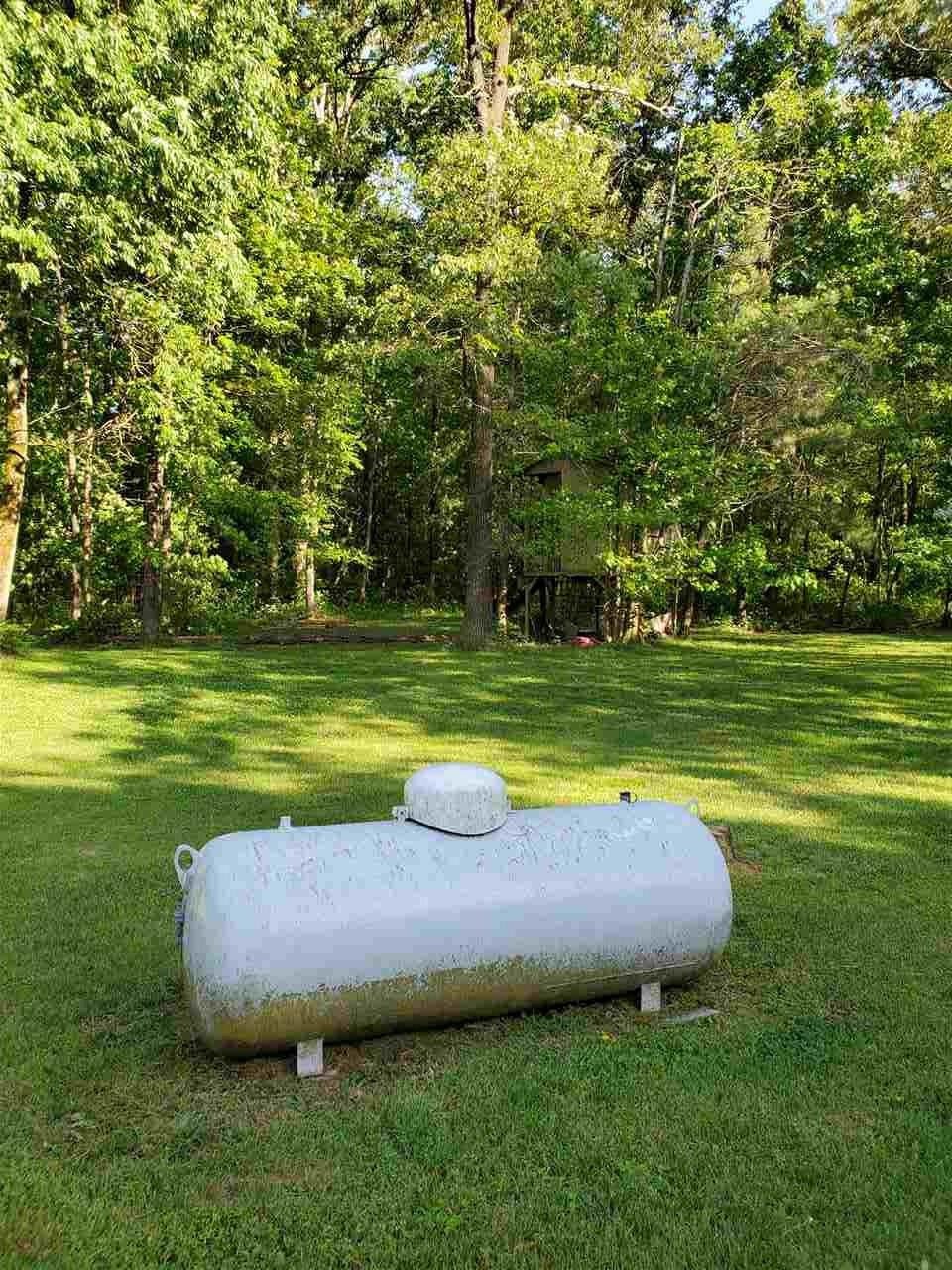 1627 Strawhill Road Southeast Cleveland, TN 37323 - Photo 7 of 48 a view of a swimming pool with a yard and large trees
