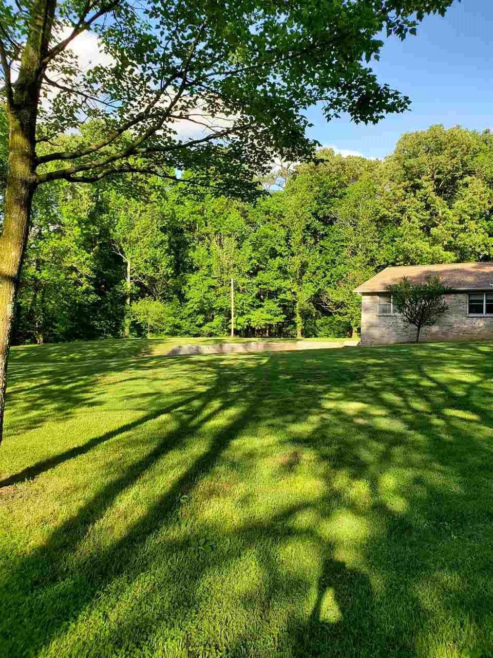 1627 Strawhill Road Southeast Cleveland, TN 37323 - Photo 8 of 48 a backyard of a house with lots of green space