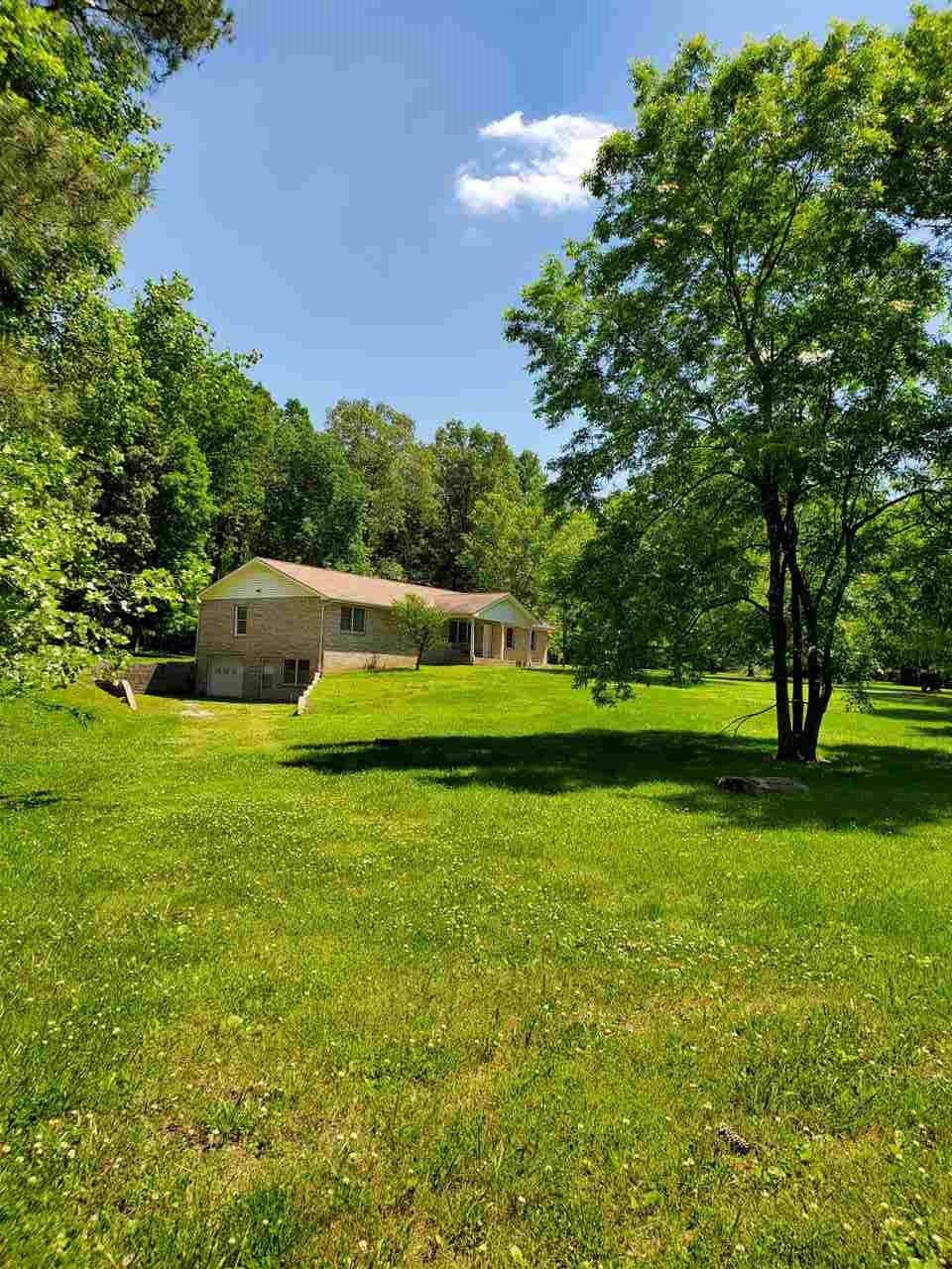 1627 Strawhill Road Southeast Cleveland, TN 37323 - Photo 9 of 48 a front view of a house with a yard