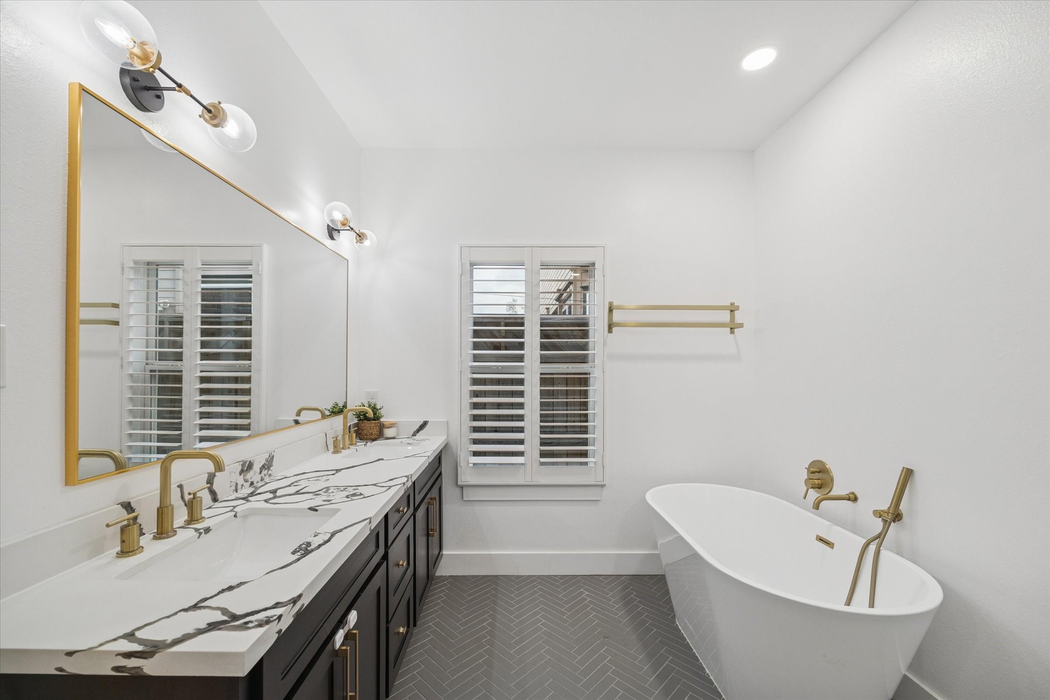 207 Tabor Street Houston, TX 77009 - Photo 12 of 25 a bathroom with a granite countertop sink and a bathtub
