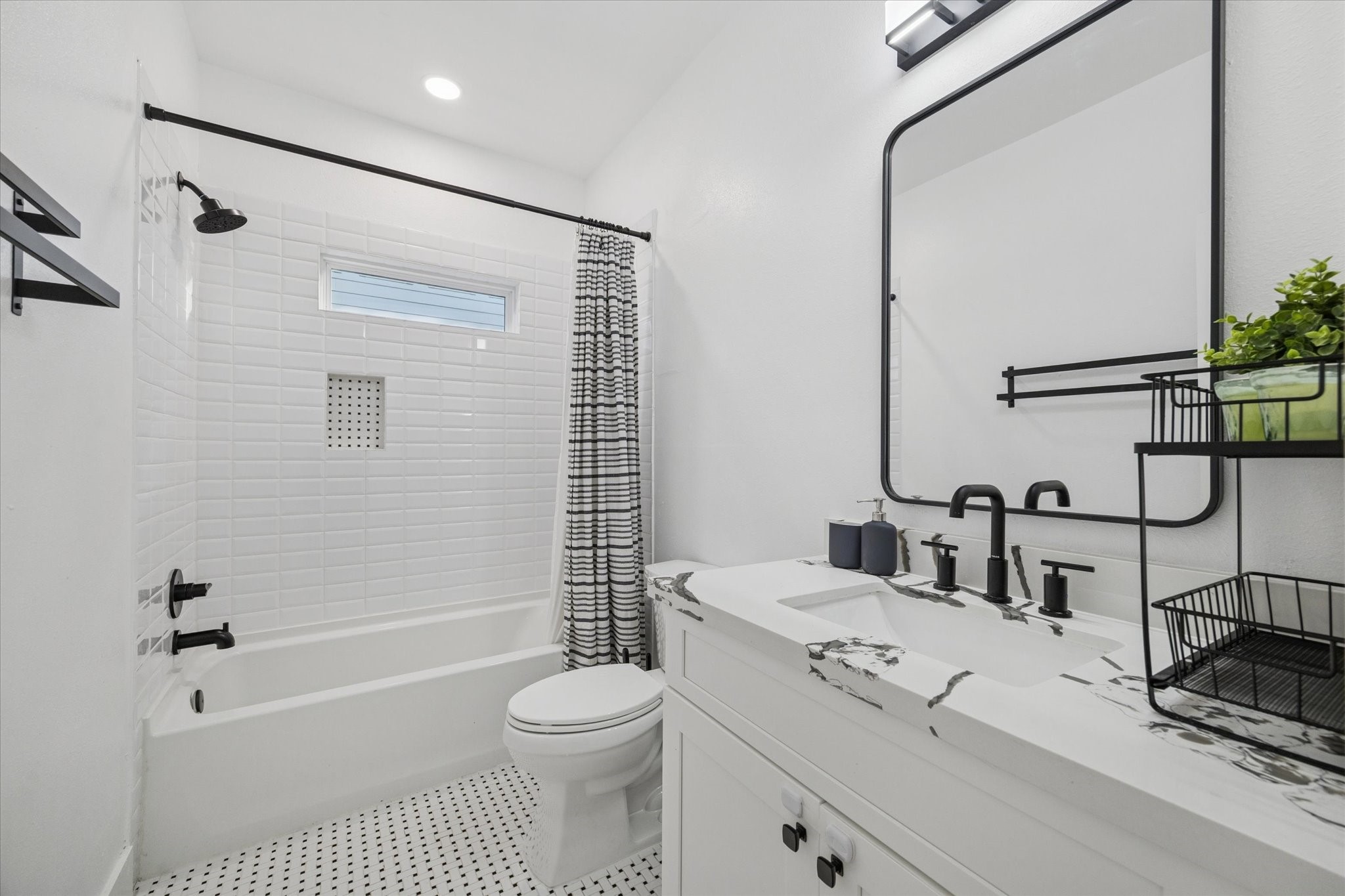 207 Tabor Street Houston, TX 77009 - Photo 16 of 25 a bathroom with a toilet a sink and a shower