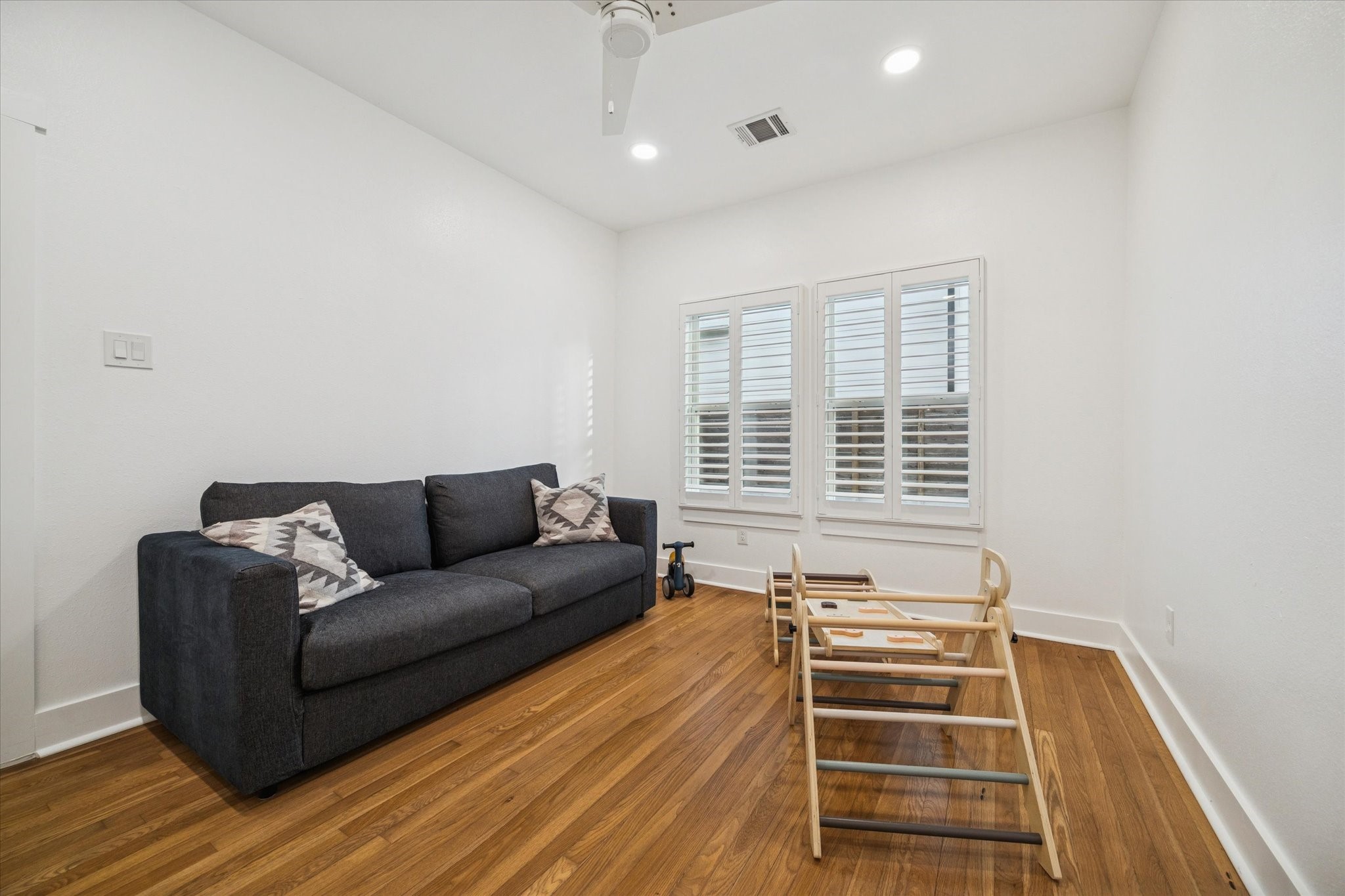 207 Tabor Street Houston, TX 77009 - Photo 17 of 25 a living room with furniture and a window