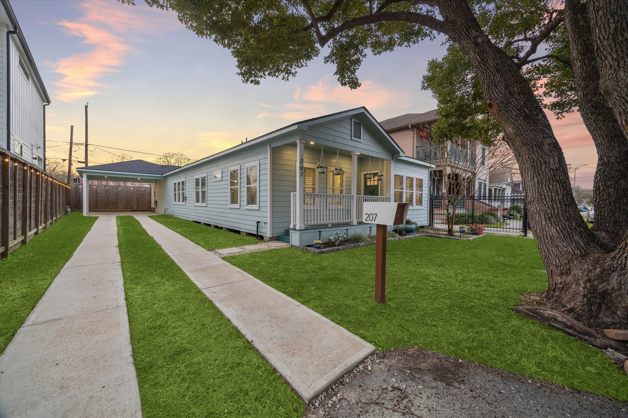207 Tabor Street Houston, TX 77009 - Photo 2 of 25 a view of a house with a yard and large tree