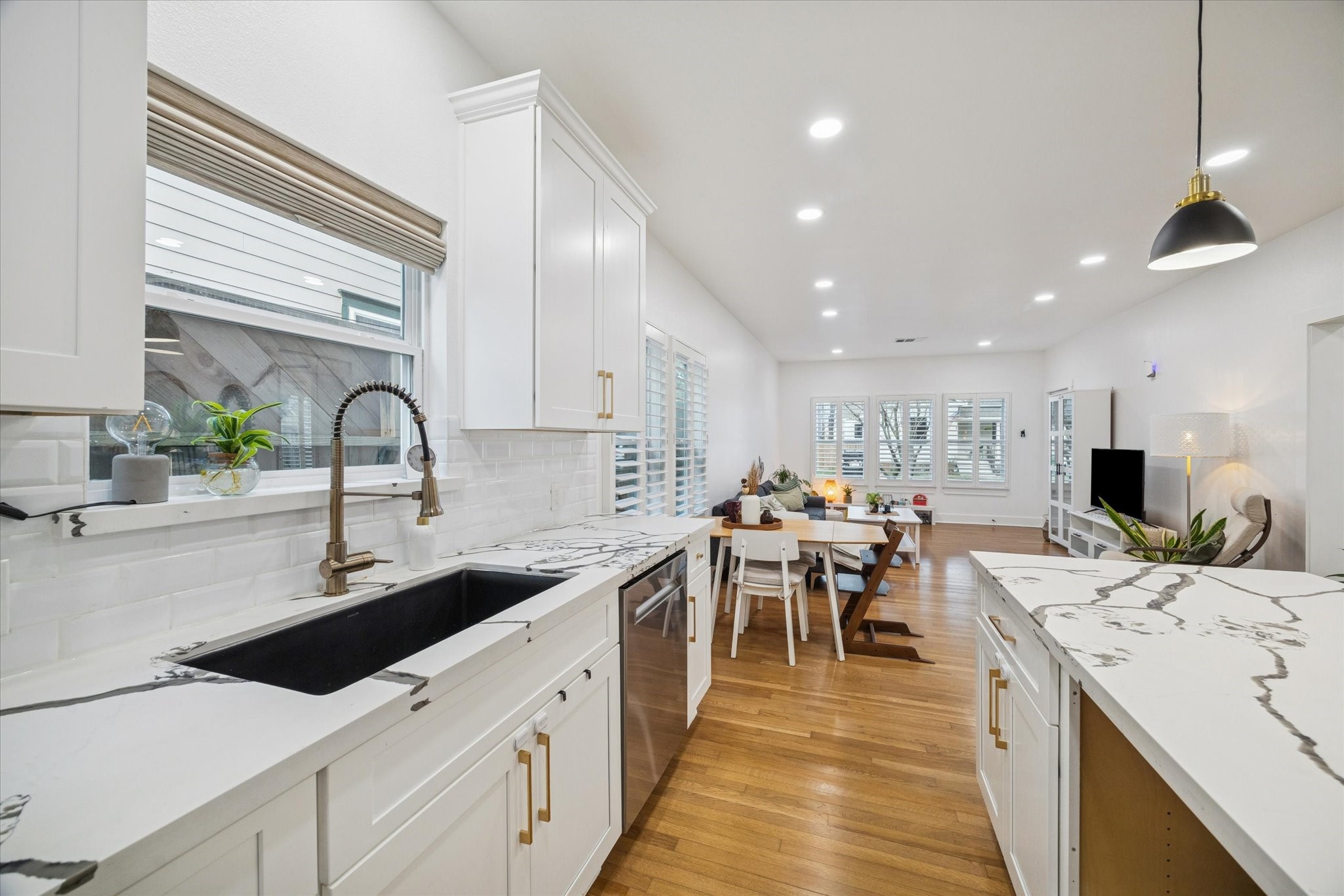 207 Tabor Street Houston, TX 77009 - Photo 5 of 25 swan neck fountain & farm-house sink. hidden microwave cubby to the bottom right.