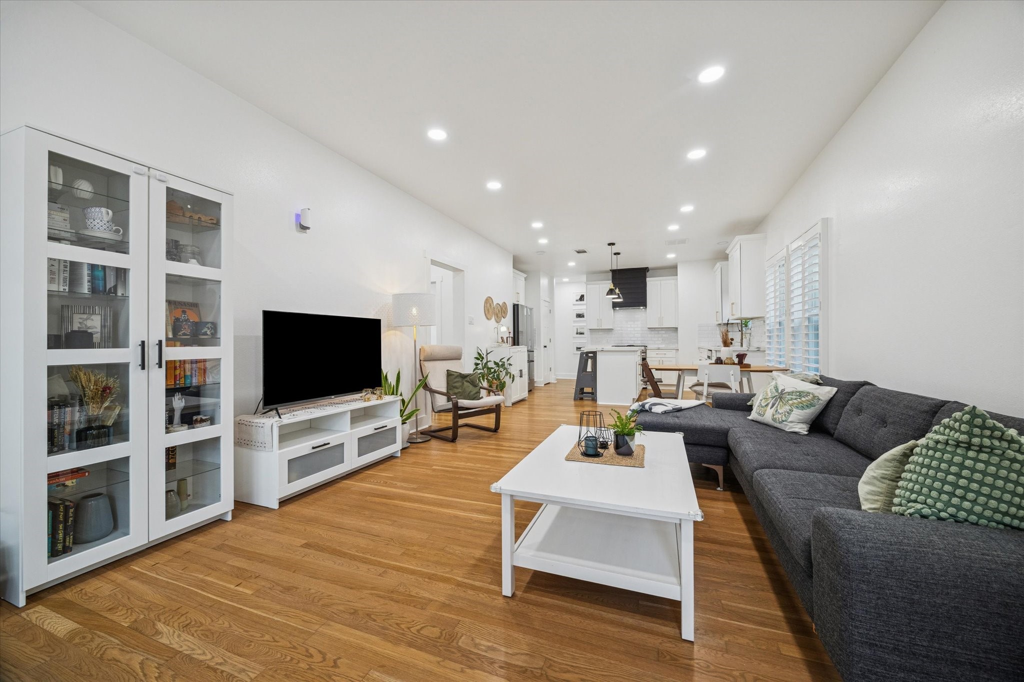 207 Tabor Street Houston, TX 77009 - Photo 6 of 25 a living room with furniture and a flat screen tv