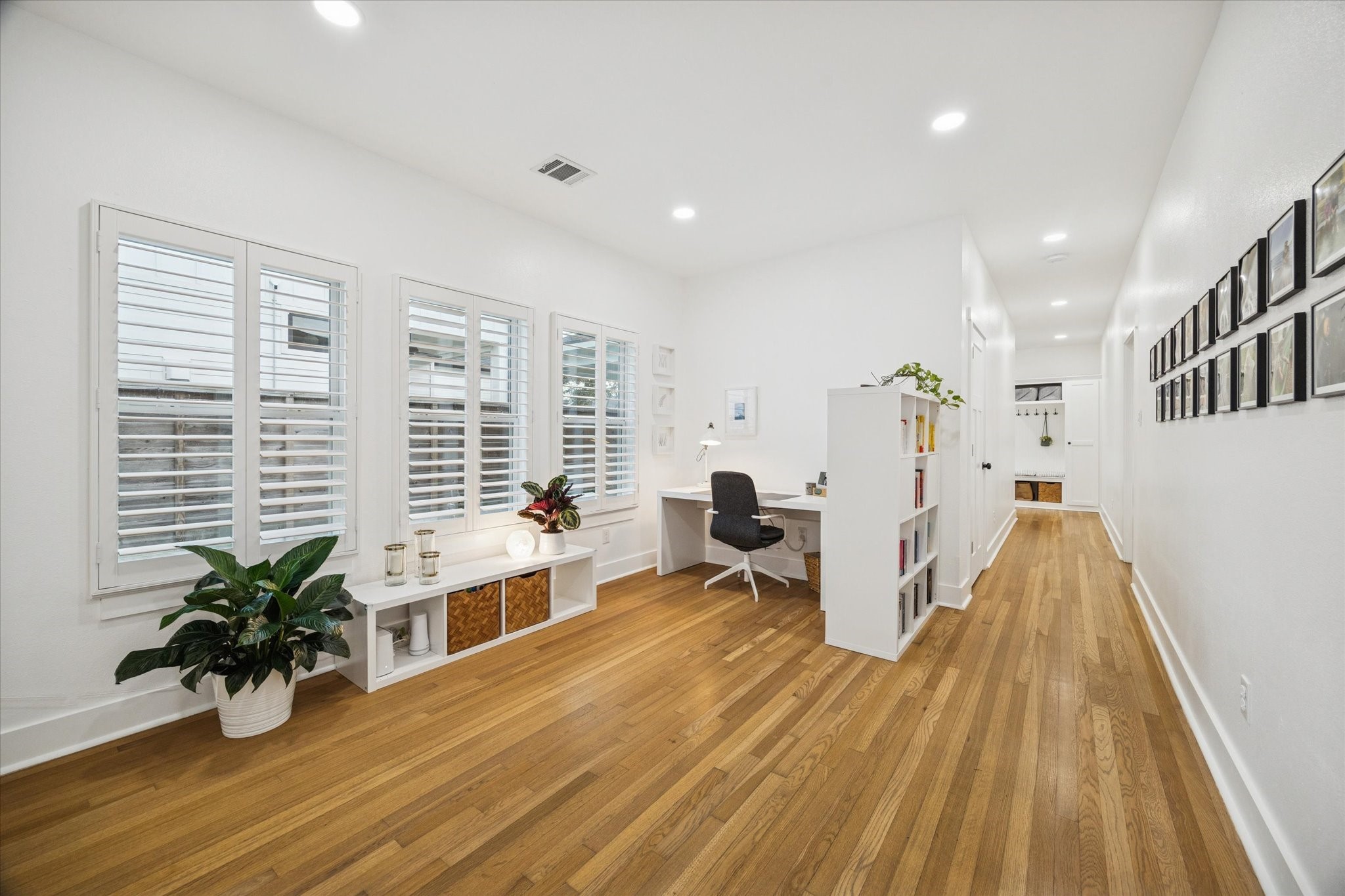 207 Tabor Street Houston, TX 77009 - Photo 8 of 25 a view of a room with wooden floor and furniture