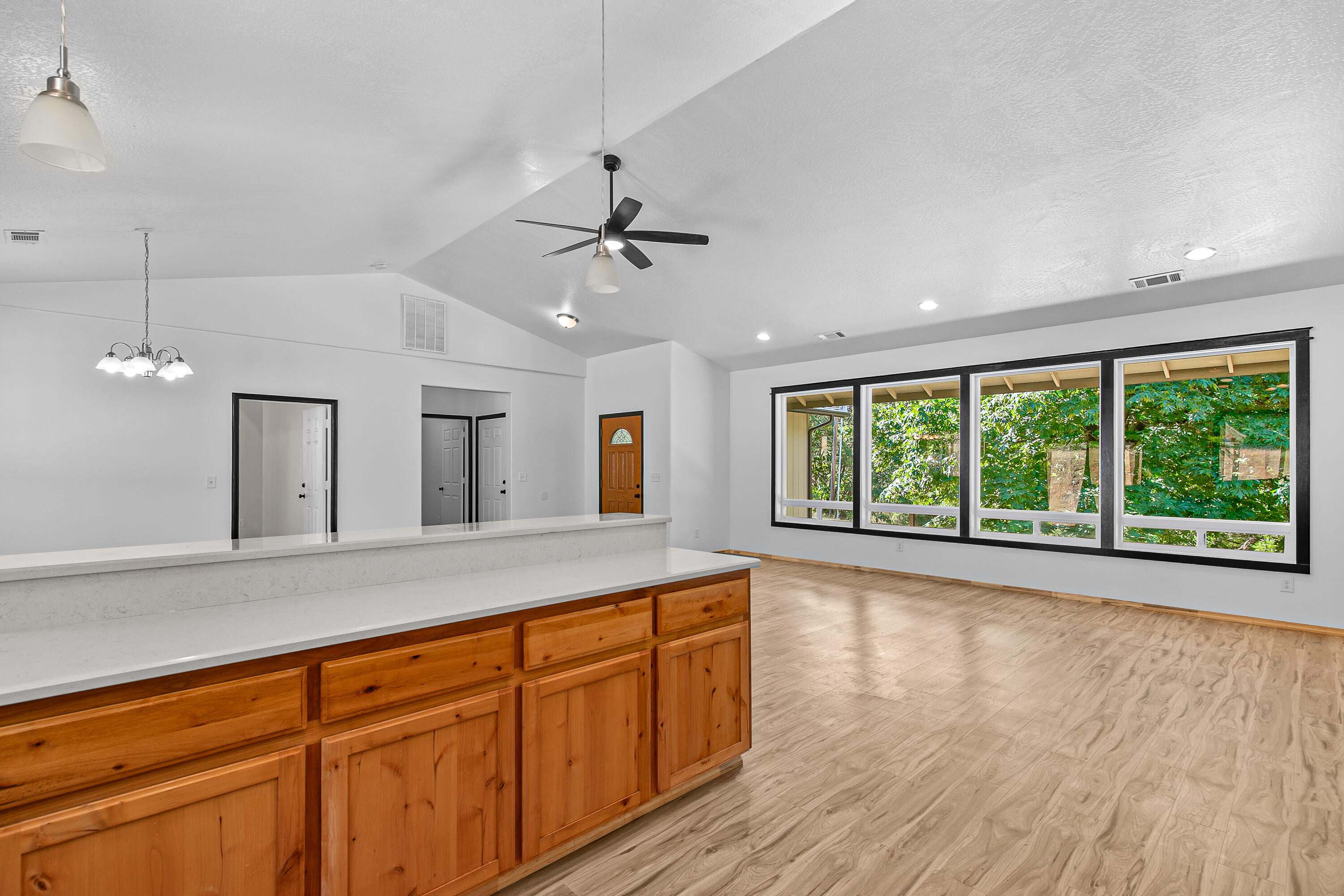 3540 Galice Road Merlin, OR 97532 - Photo 8 of 47 a open kitchen with granite countertop a large window cabinets and stainless steel appliances