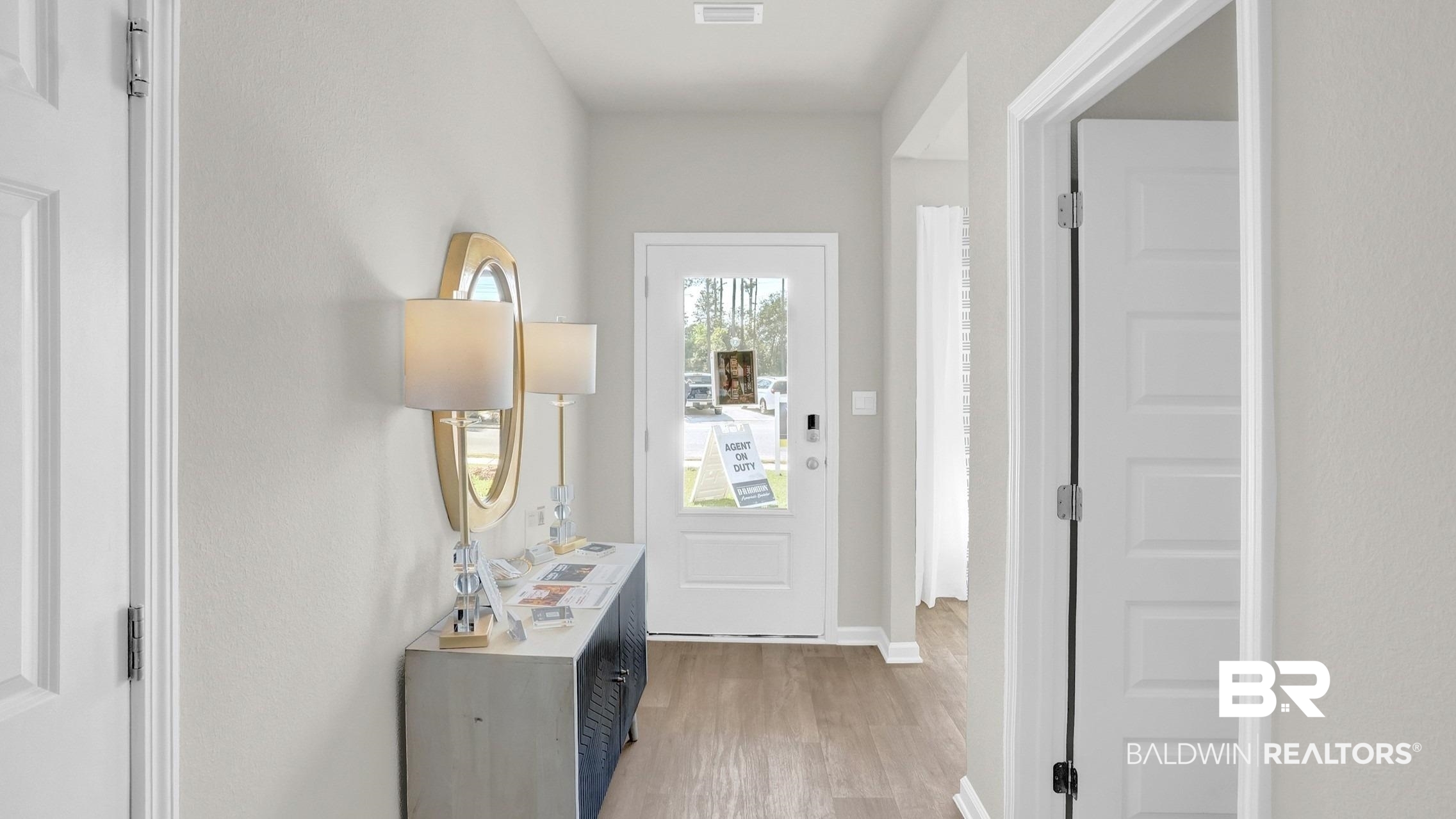 293 Hudson Loop Fairhope, AL 36532 - Photo 26 of 30 Doorway to outside featuring wood finished floors and baseboards