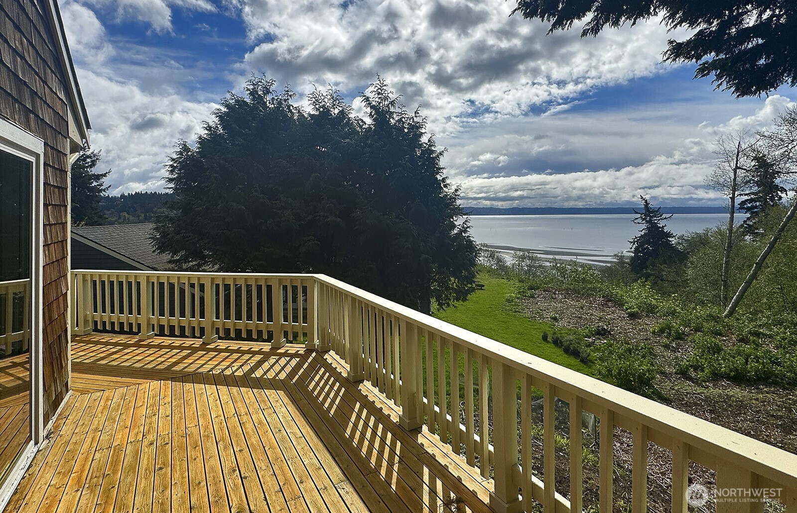 3760 Periwinkle Road Clinton, WA 98236 - Photo 7 of 34 a view of balcony with wooden floor and fence