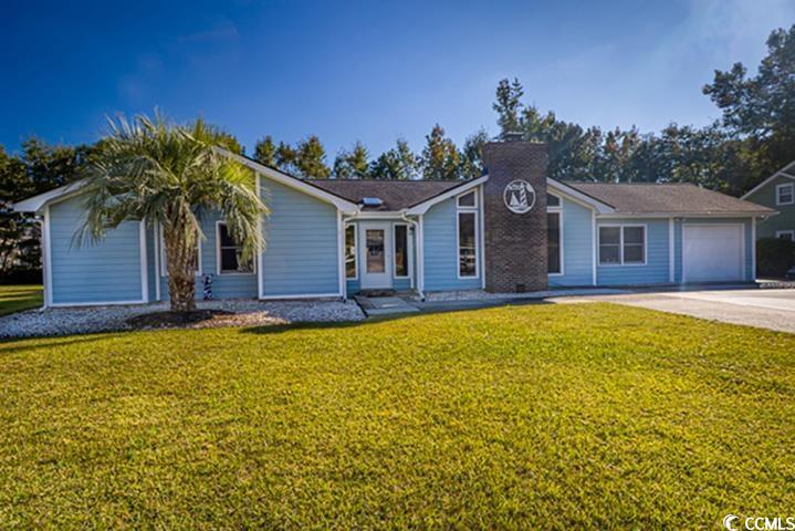 102 Plantation Road Myrtle Beach, SC 29588 - Photo 1 of 36 Single story home with a front lawn, driveway, and an attached garage