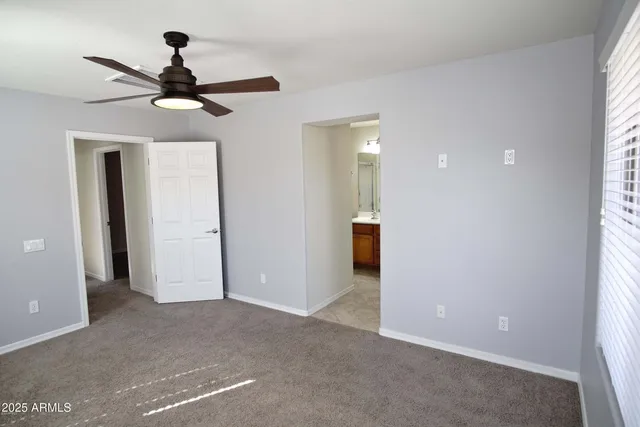 a bathroom with a double vanity sink mirror and shower