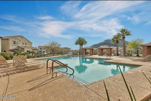 a view of a garden with a building in the background