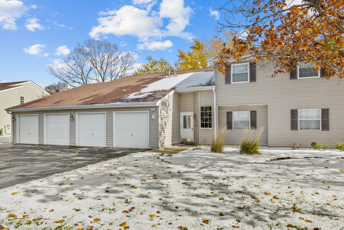 96 Gant Circle, Unit B Streamwood, IL 60107 - Photo 1 of 21 a front view of a house with a yard