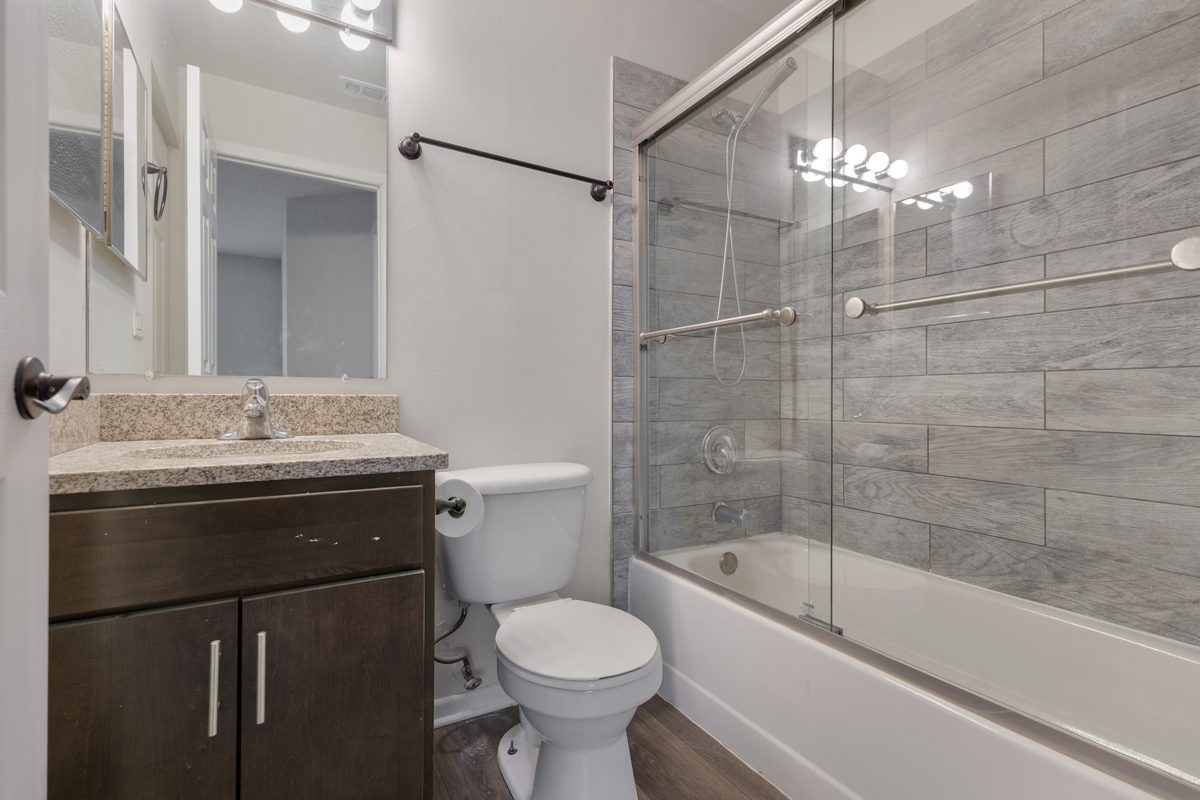 96 Gant Circle, Unit B Streamwood, IL 60107 - Photo 13 of 21 a bathroom with a sink toilet and shower