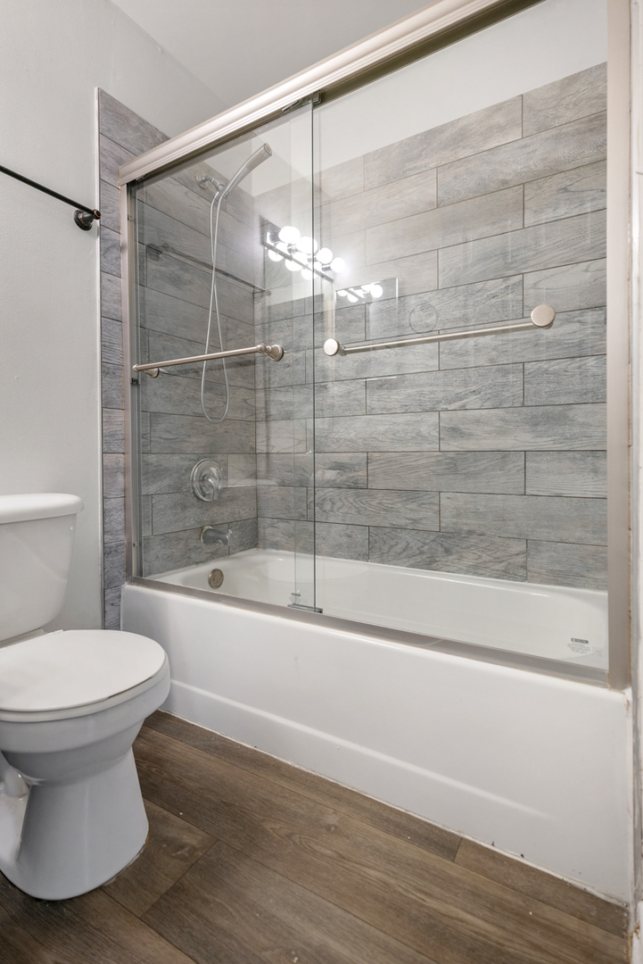 96 Gant Circle, Unit B Streamwood, IL 60107 - Photo 14 of 21 a bathroom with a toilet and a shower