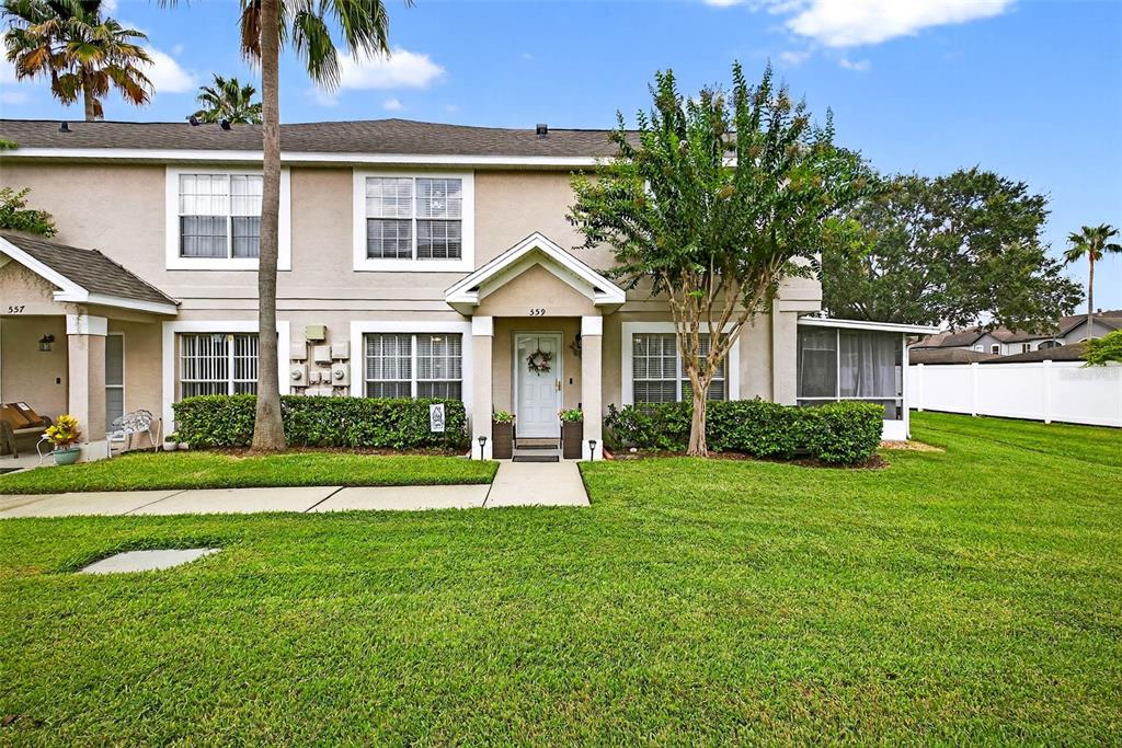 559 Kensington Lake Circle Brandon, FL 33511 - Photo 1 of 1 a front view of a house with a yard and garage