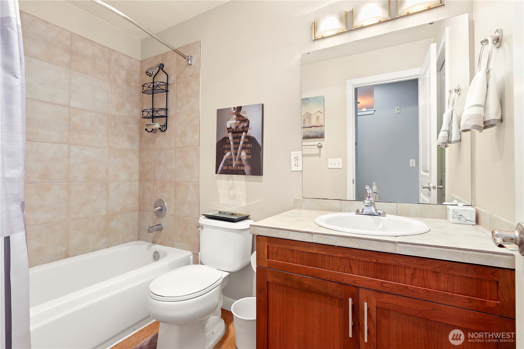 3906 243rd Place Southeast, Unit P202 Bothell, WA 98021 - Photo 13 of 17 a bathroom with a sink a toilet and shower