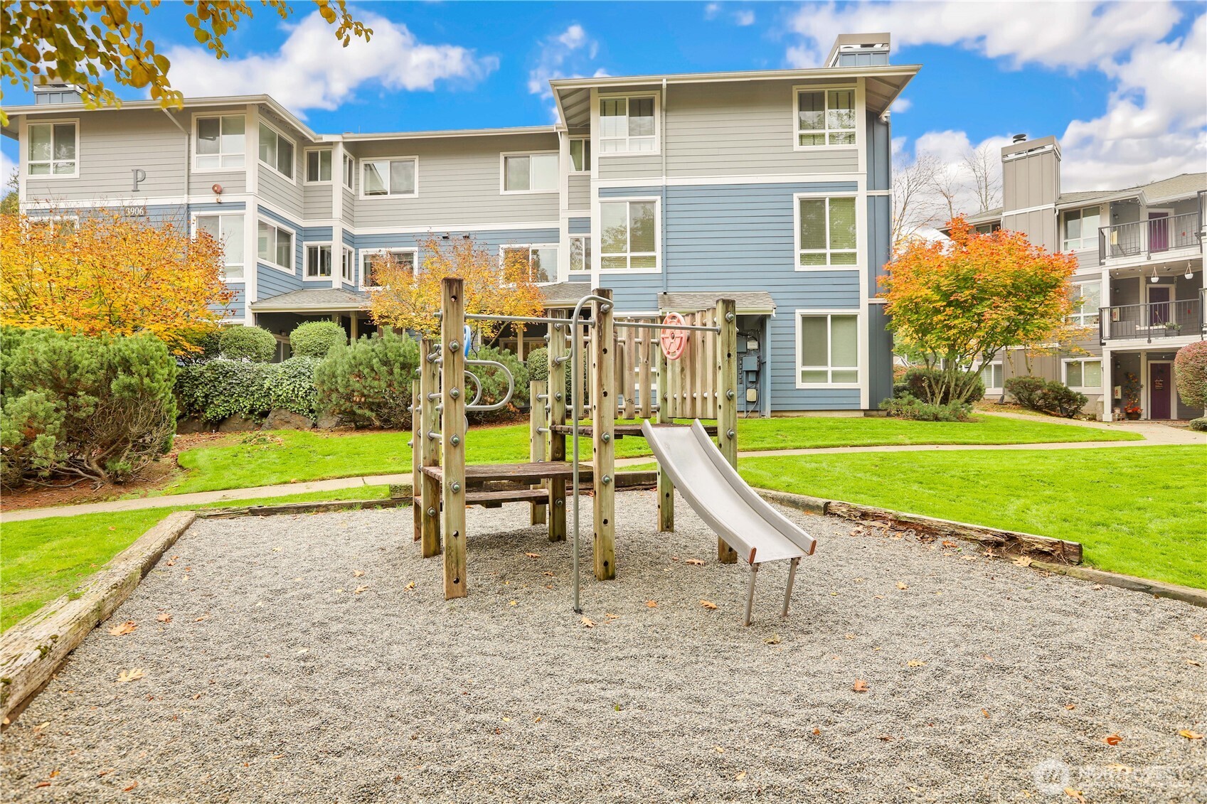 3906 243rd Place Southeast, Unit P202 Bothell, WA 98021 - Photo 15 of 17 a garden with swimming pool in front of the house