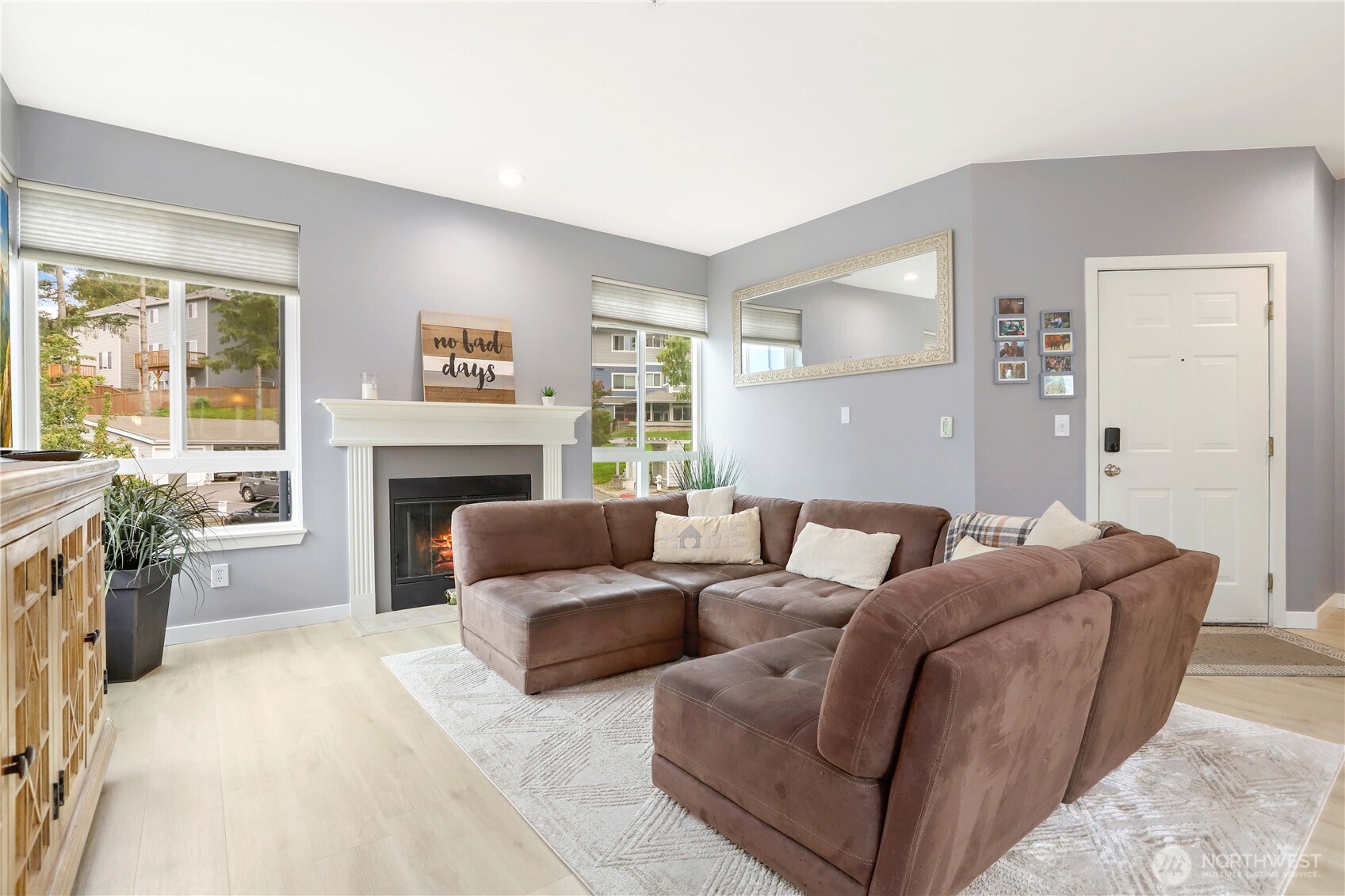 3906 243rd Place Southeast, Unit P202 Bothell, WA 98021 - Photo 4 of 17 a living room with furniture and a fireplace