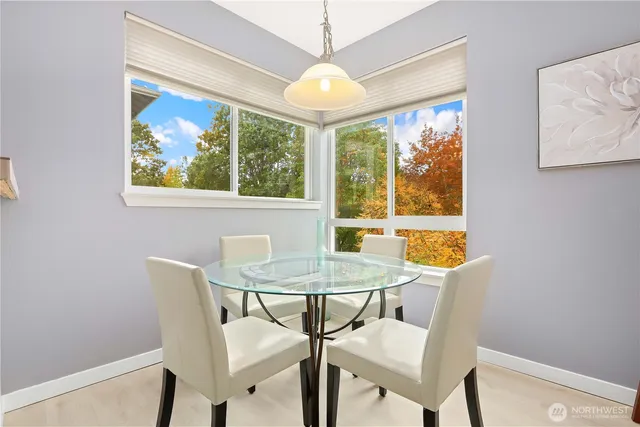 a dining room with furniture and window