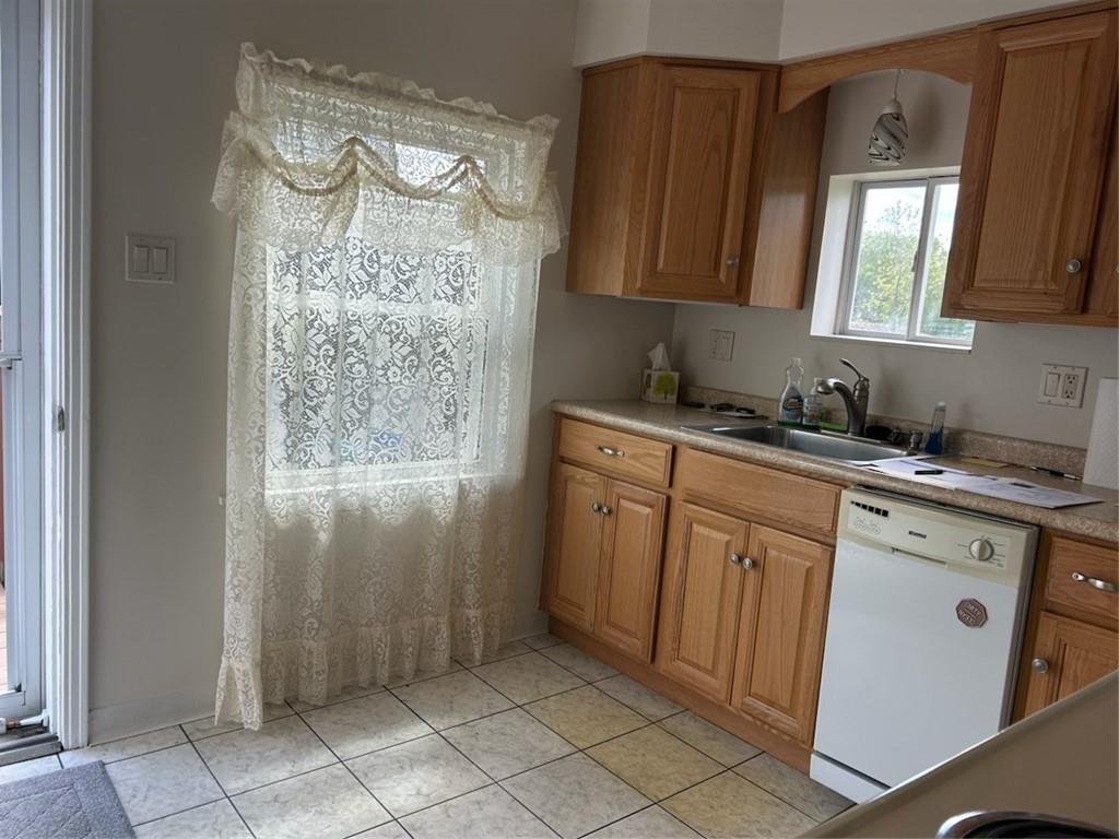314 Terrace McKeesport, PA 15135 - Photo 5 of 19 a kitchen with stainless steel appliances granite countertop a refrigerator and a sink