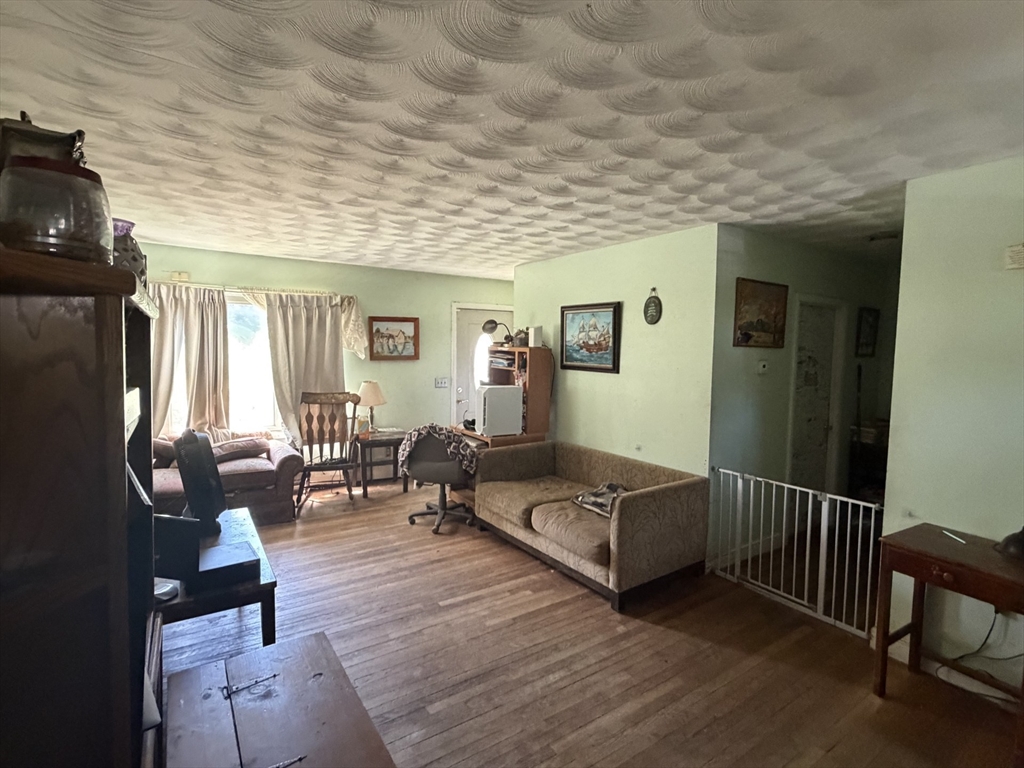 42 Birch Road Westford, MA 01886 - Photo 10 of 10 a living room with furniture and a wooden floor