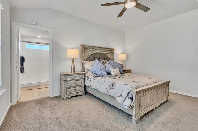 a bedroom with a bed and a dresser