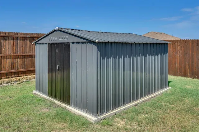 a view of a house with a backyard porch and sitting area