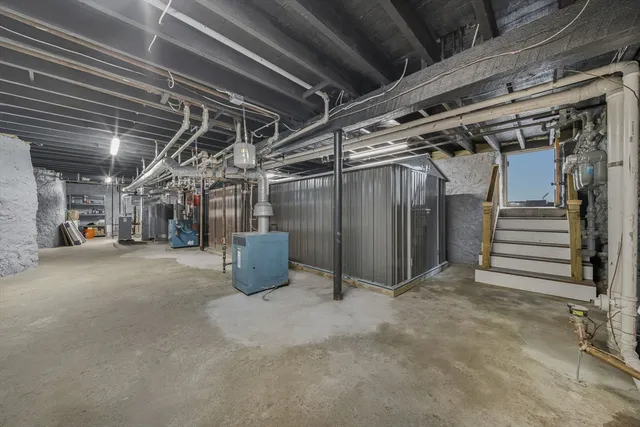 a view of empty room with wooden ceiling